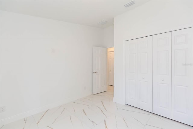 unfurnished bedroom featuring a closet