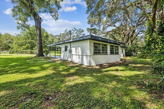 view of side of property featuring a lawn