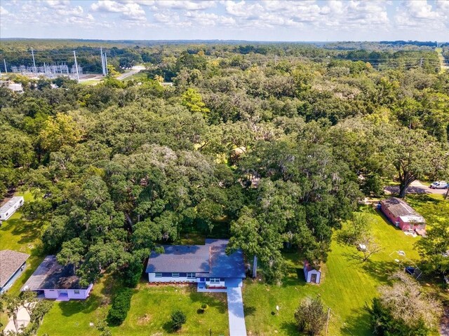aerial view featuring a wooded view