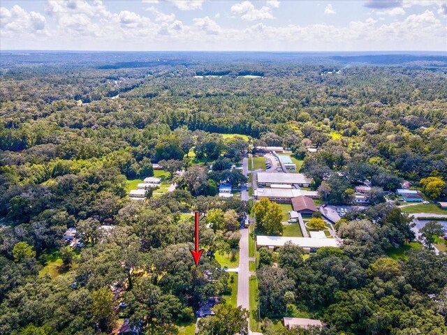 bird's eye view featuring a wooded view