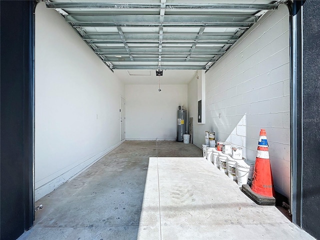 garage featuring electric water heater, a garage door opener, and electric panel