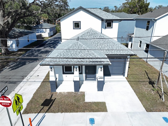 view of front facade with a front yard and a garage