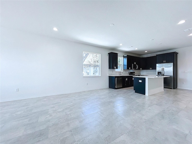 kitchen with appliances with stainless steel finishes and a center island