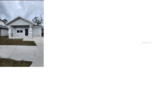 view of front of home featuring driveway and an attached garage