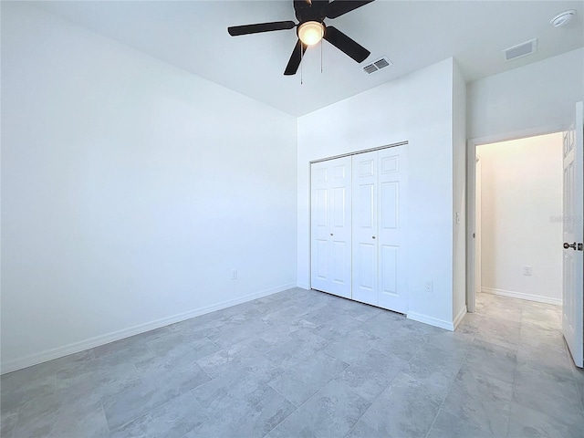 unfurnished bedroom featuring a closet, visible vents, and baseboards