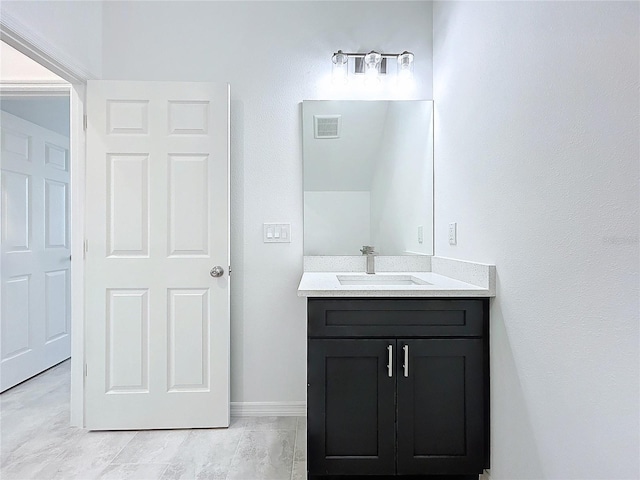 bathroom featuring visible vents and vanity