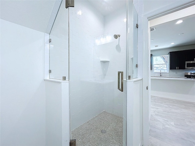 full bath featuring a stall shower and visible vents