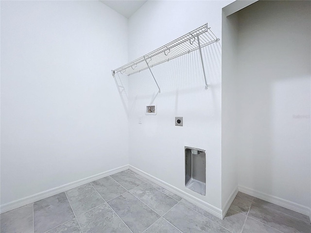 laundry room featuring laundry area, washer hookup, electric dryer hookup, and baseboards