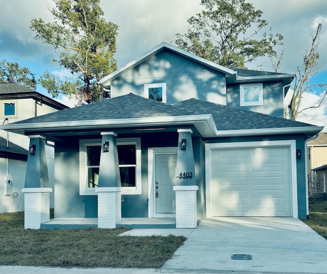 view of front of house featuring covered porch and a garage