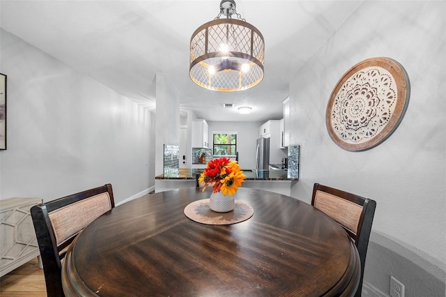 dining space with an inviting chandelier