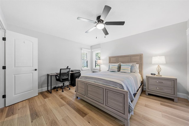 bedroom with light hardwood / wood-style floors and ceiling fan