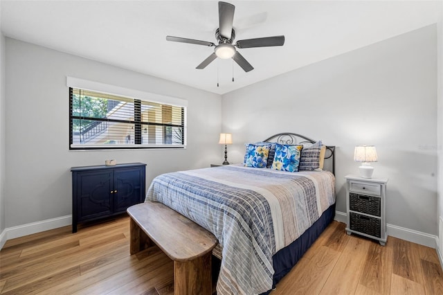 bedroom with hardwood / wood-style floors and ceiling fan