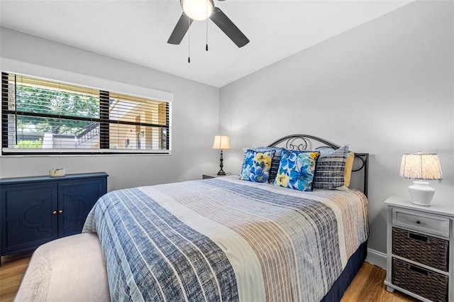 bedroom with hardwood / wood-style flooring and ceiling fan