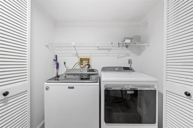 clothes washing area with independent washer and dryer