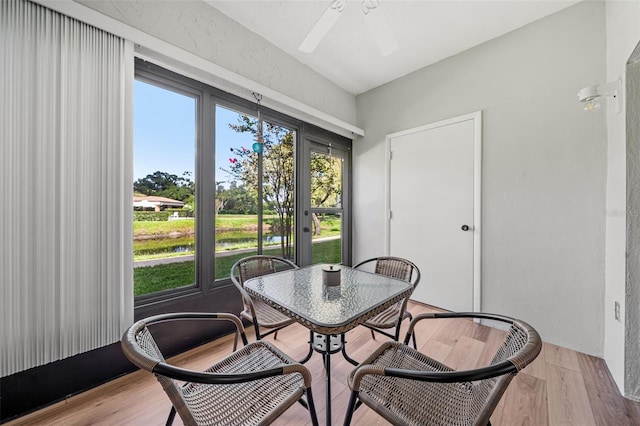 dining space featuring light hardwood / wood-style floors and ceiling fan