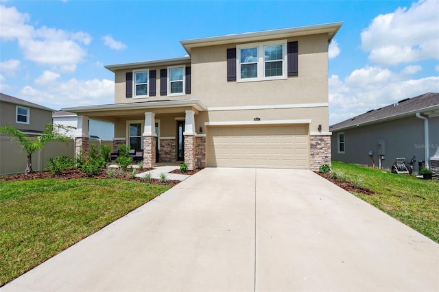 view of front of home with a garage and a front lawn