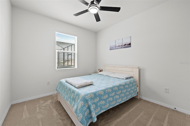 bedroom featuring ceiling fan and light colored carpet