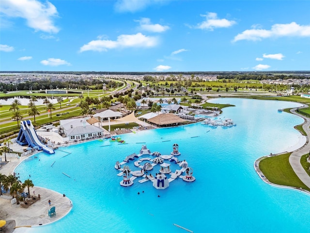 view of swimming pool featuring a water view and a water slide