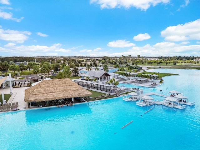 view of swimming pool with a water view