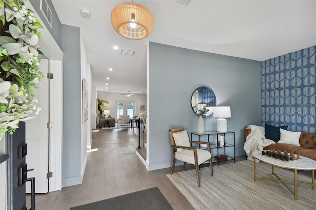 foyer entrance featuring ceiling fan and light hardwood / wood-style flooring