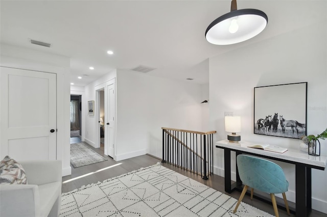 home office with light hardwood / wood-style floors