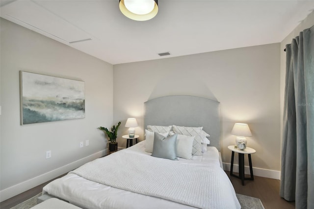 bedroom with dark wood-type flooring