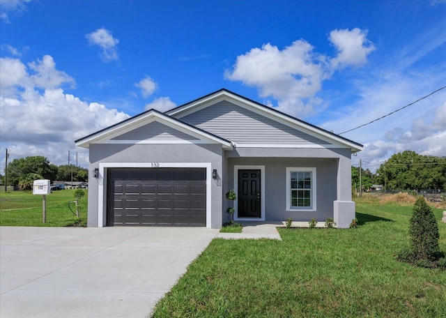 view of front of home with a front lawn and a garage