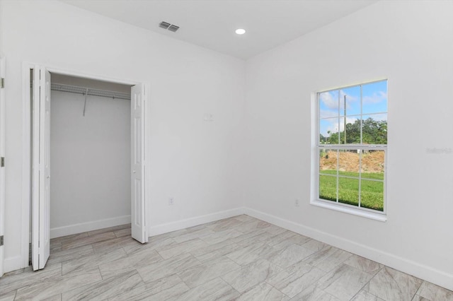 unfurnished bedroom with a closet