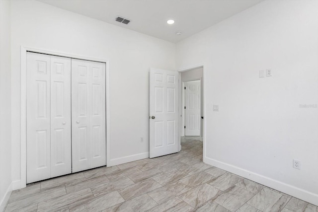 unfurnished bedroom featuring a closet