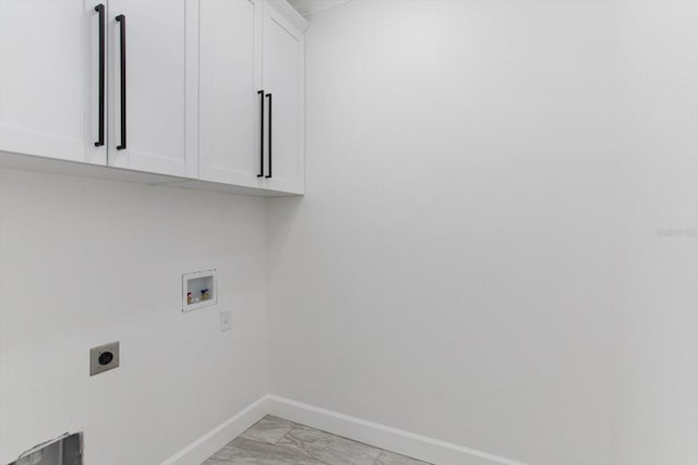 laundry room featuring washer hookup, cabinets, and hookup for an electric dryer