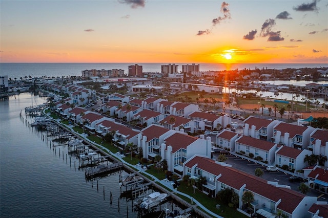 aerial view at dusk with a water view