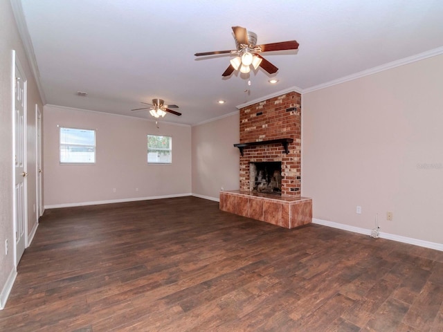 unfurnished living room featuring a fireplace, dark hardwood / wood-style flooring, ceiling fan, and ornamental molding