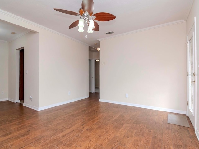 spare room with ceiling fan, wood-type flooring, and crown molding