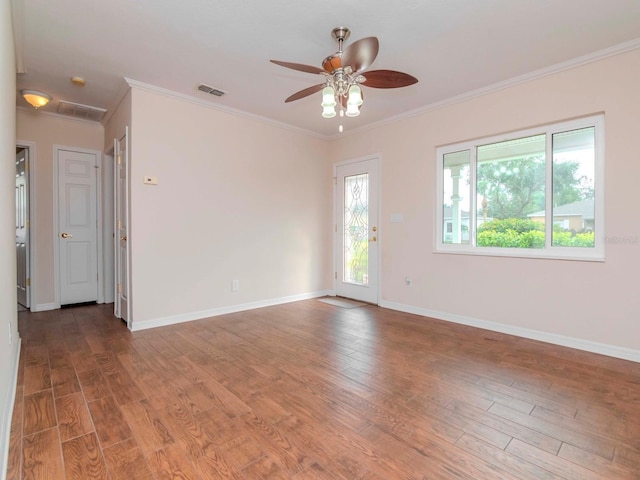 unfurnished room with hardwood / wood-style flooring, ceiling fan, and crown molding