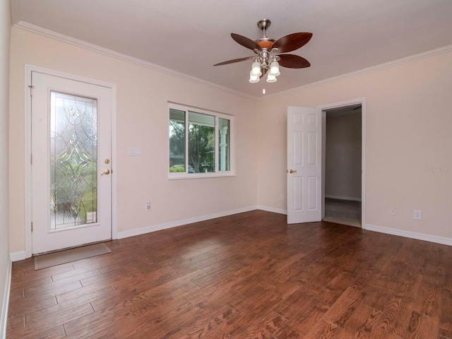 empty room featuring dark hardwood / wood-style flooring, ceiling fan, and ornamental molding