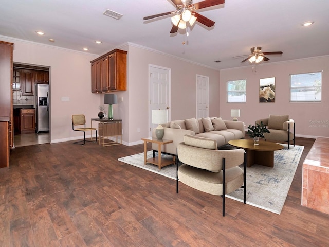 living room featuring dark wood-type flooring, ceiling fan, and ornamental molding