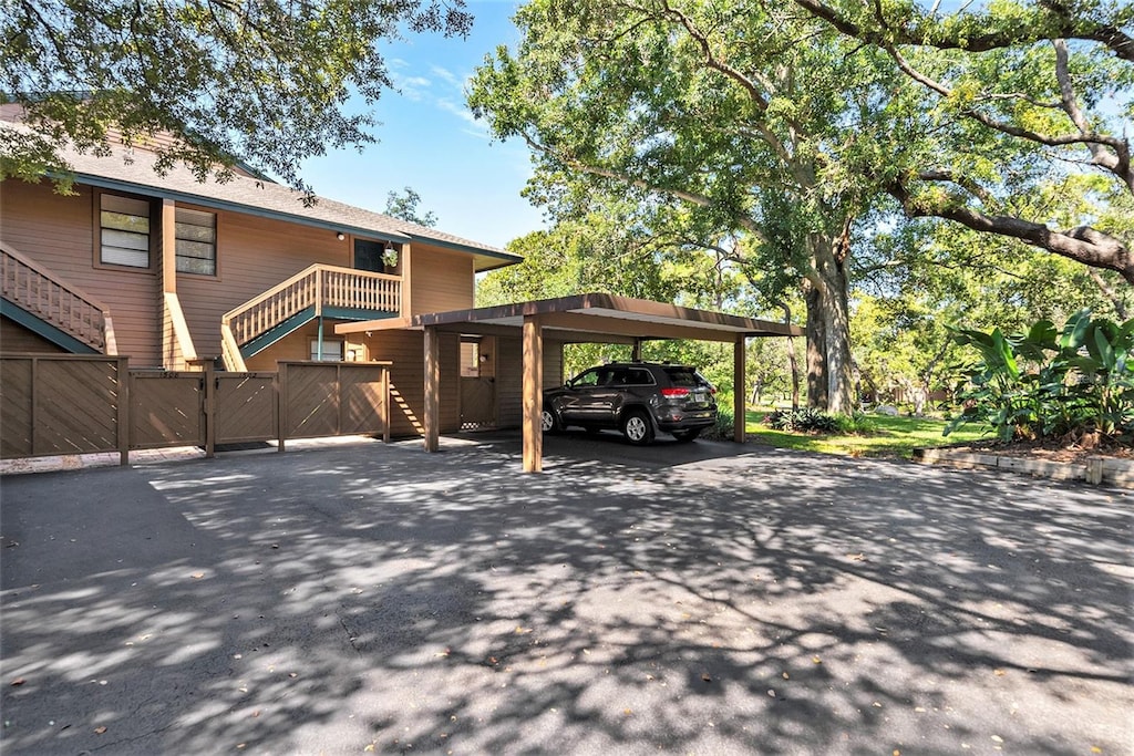 view of vehicle parking featuring a carport