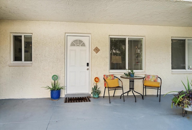 property entrance with a patio