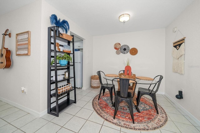 dining room featuring light tile patterned floors