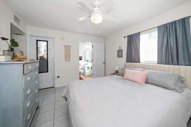 tiled bedroom featuring ceiling fan