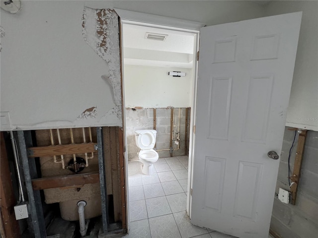 bathroom featuring tile patterned floors and toilet