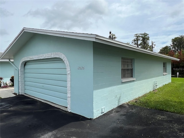 view of side of home with a garage