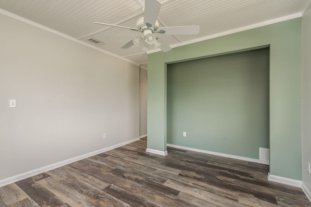 empty room with ceiling fan, crown molding, and dark wood-type flooring