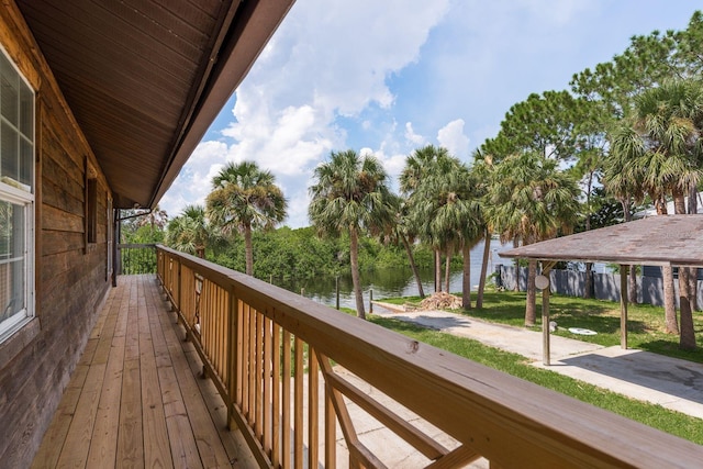 wooden deck with a water view