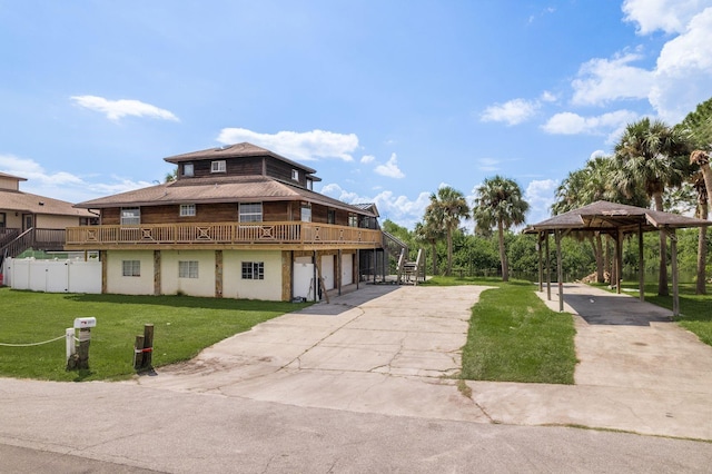 view of front of home with a garage and a front yard