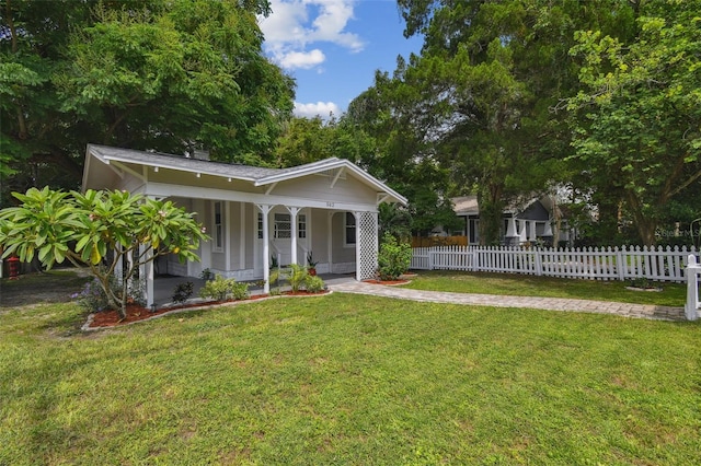 exterior space featuring covered porch and a yard