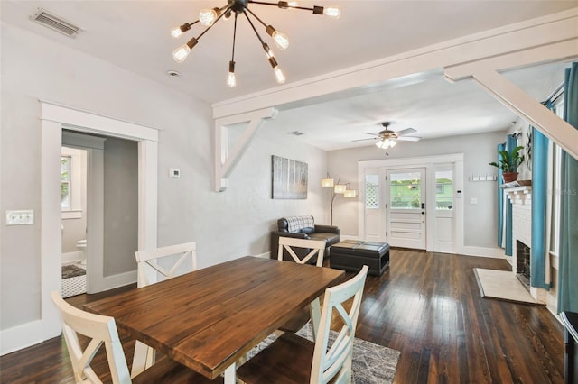 dining room with dark hardwood / wood-style flooring and ceiling fan