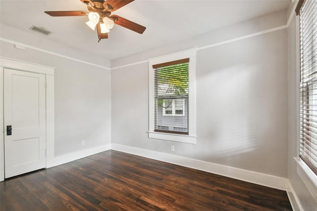 unfurnished room with ceiling fan and dark hardwood / wood-style floors