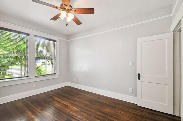 empty room featuring dark hardwood / wood-style floors and ceiling fan