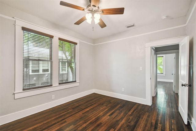 unfurnished room featuring ceiling fan and dark wood-type flooring